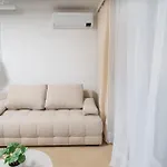 Beige Harmony For Family & Business With Parking And Ac By Uniquerent